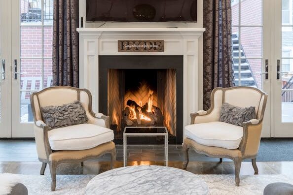 pexels-photo-2343466-2343466 Stylish and contemporary living room featuring a cozy fireplace and elegant furniture.